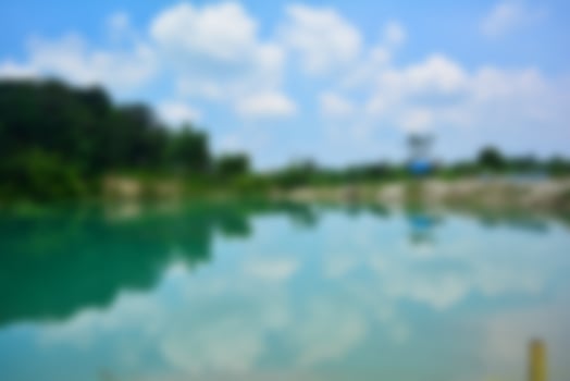 Blur of lake talaga biru background in summer, turqoise nature concept photo
