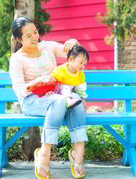 Smiling mother and little daughter on nature. photo