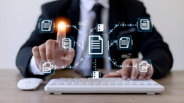 Businessman working with electronics document icons, E-document management, online documentation database, paperless office concept photo