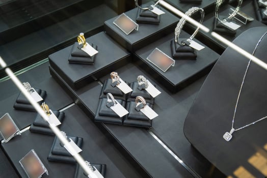 Gold jewelry diamond rings show in luxury retail store window display showcase photo