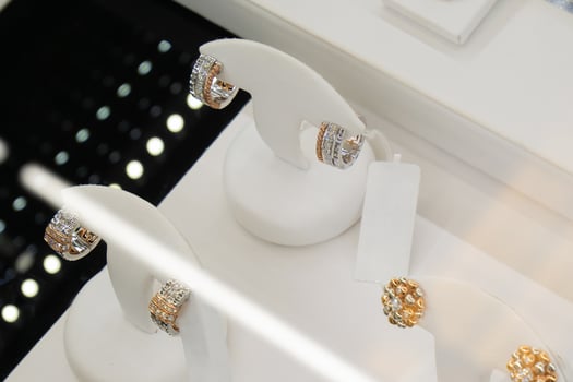 jewelry diamond earrings show in luxury retail store window display showcase photo