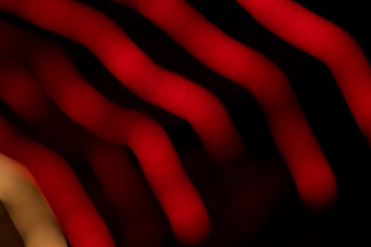 Red Defocus Abstract bokeh light effects on the night black background texture photo