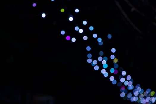 Blue Defocus Abstract bokeh light effects on the night black background texture photo