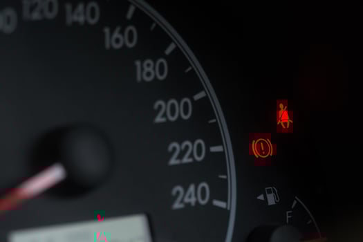 The car red dial icon shows a red belt warning. photo