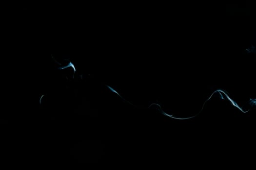 White smoke on black background for layer overlay effect. A realistic smoke or fog effect for photo and video manipulation effect and mystery design theme