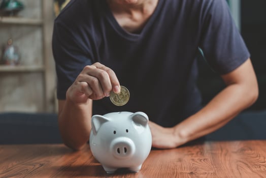 Investment Crypto Bitcoin blockchain Finance Banking economy exchange trade stock market and saving money man holding coin putting piggy bank business concept. photo