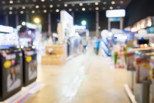 Washing machines in home appliance electronic department retail store blur background photo