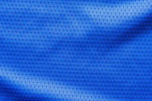 Blue color fabric sport clothing football jersey with air mesh texture background photo