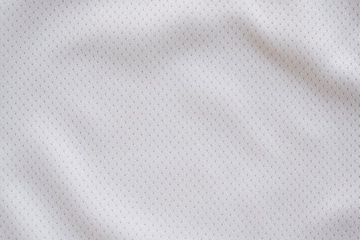 White fabric sport clothing football jersey with air mesh texture background photo