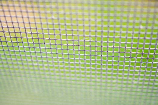 mosquito net wire screen close up on house window protection against insect photo