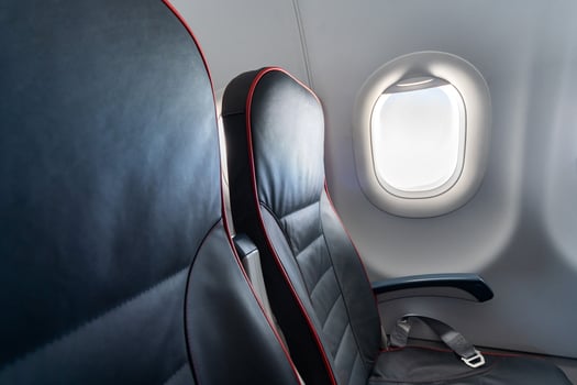 Airplane seats and windows. Economy class comfortable seats without passengers. New low-cost carrier airline photo
