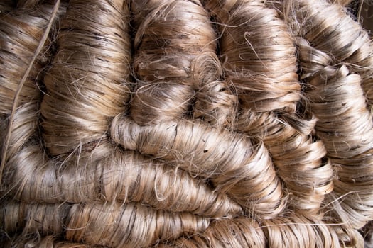 A thick bundle of Golden jute fiber Texture Background photo