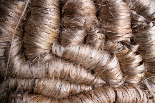 A thick bundle of Golden jute fiber Texture Background photo