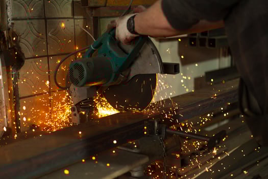 Sawing steel. Circular saw and sparks. Production details. Metal cutting. photo