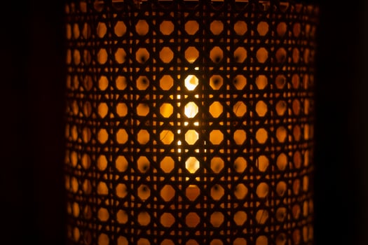 Wooden lamp. Lampshade for incandescent lamp. Light in dark. photo