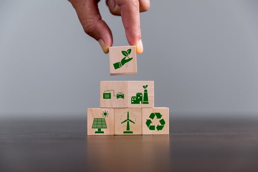 Companies are targeting net zero greenhouse gas emissions. Carbon credit concept.Tradable certificate to drive industry in direction of low emissions in efficiency cost. Wooden cubes with decrease CO2 photo