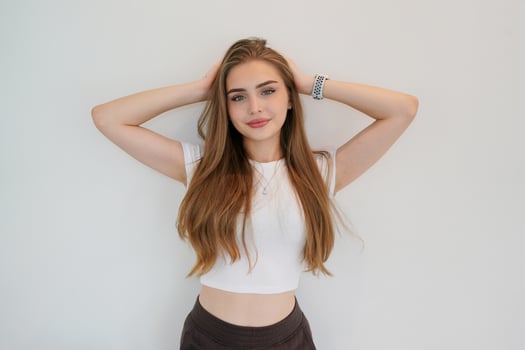 A beautiful young woman posing in a white shirt photo