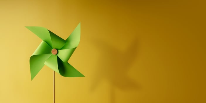 ESG and Clean Energy Concept. Close-up of Wind Turbine Paper. Decrease Carbon and Produce a Green Power. World Earth Day, Sustainable Resources, Environmental and Ecology Care photo