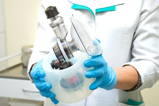 Respiratory mask with resuscitator for ventilation of a patient with pneumonia in the operating room of a hospital photo