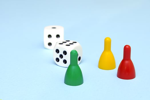 chips and dice for the game on a blue background photo