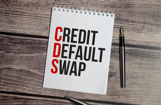 CDS Credit Default Swap text on white paper on wooden background photo
