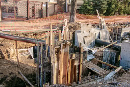 Construction of a high-rise building. Pouring of foundation columns with concrete photo