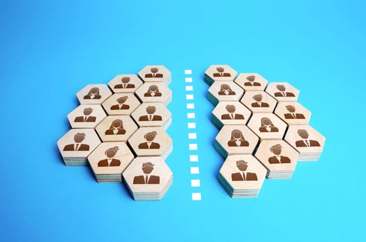 People were divided into two groups. Community split. Conflict resolution. Integrity violation. Public opinion differences. Merging into a organization. Association breakup. Staff cuts, mass layoffs. photo