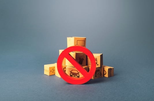 Boxes and red prohibition sign NO. Lack of goods and stable deliveries. Shortage of products delivery. Sanctions and embargo. Trend changes in consumer market. Out of business. Retail photo