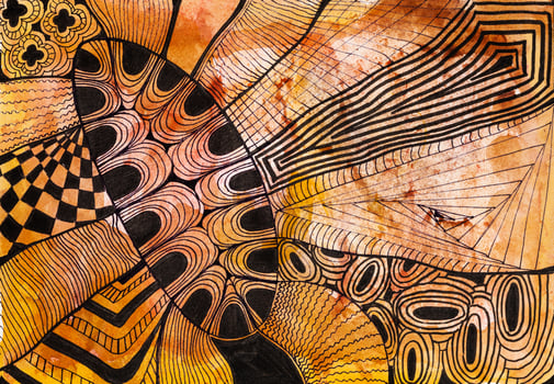 abstract black ornament on brown colored paper photo
