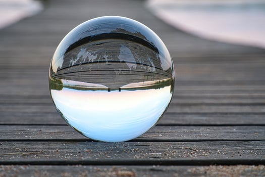 Glass ball on a wooden pier at a Swedish lake at evening hour. Nature Scandinavia photo