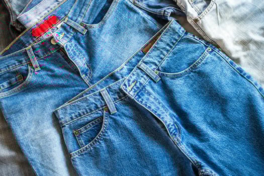 many denim blue jeans background photo