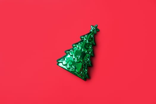 Christmas tree on red background new year holiday celebration concept photo