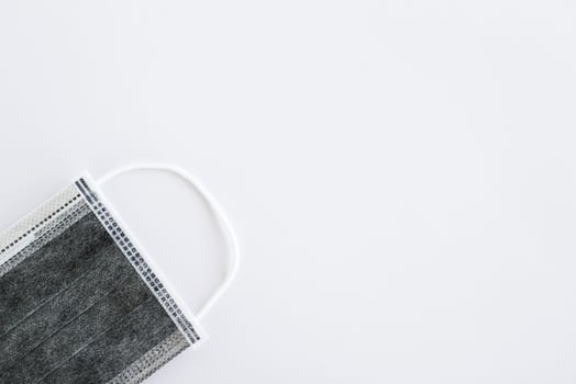 Flat lay on medical face mask on white background with copy space. Healthcare and medical concept. photo