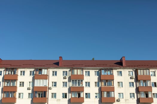 Building in city. House with apartments. Facade of residential building. photo