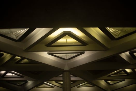 Light triangle. Lamp on ceiling. Light design. Architecture of 20th century. photo