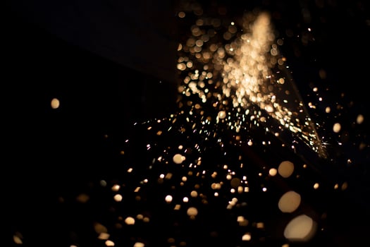 Sparks in dark. Metal grinding lights. Details of grinder's work. photo