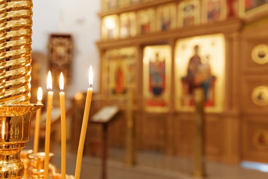 Orthodox Church. Christianity. Festive interior decoration with burning candles and icon in traditional Orthodox Church on Easter Eve or Christmas. Religion faith pray symbol. photo