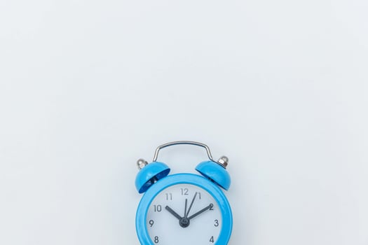 Simply flat lay design Ringing twin bell vintage classic alarm clock Isolated on white background. Rest hours time of life good morning night wake up awake concept. Flat lay top view copy space. photo
