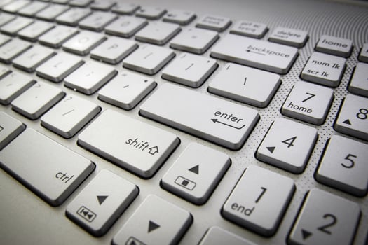 computer keyboard with enter button photo