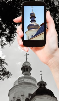 tourist taking photo of church in Kiev