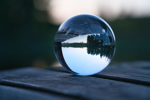 Glass ball on a wooden pier at a Swedish lake at evening hour. Nature Scandinavia photo