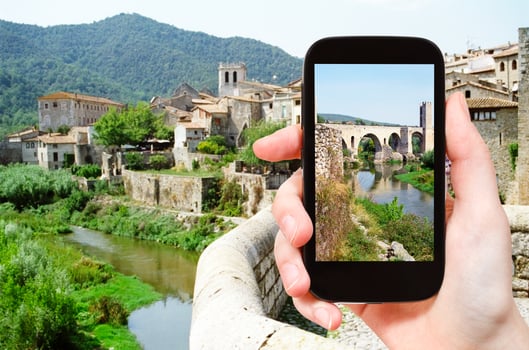 tourist photographs of bridge in Besalu town photo