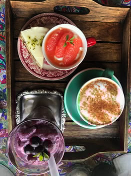 refreshing healthy dessert of ice and grapefruit, fresh blackcurrant and cappuccino coffee. background and interior. photo