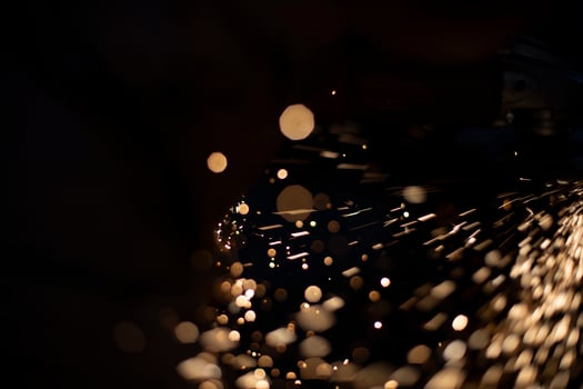Sparks in dark. Metal grinding lights. Details of grinder's work. photo
