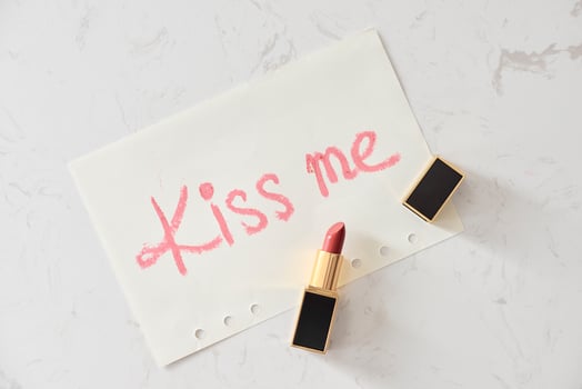 a kiss on a white background lipstick. selective focus. photo