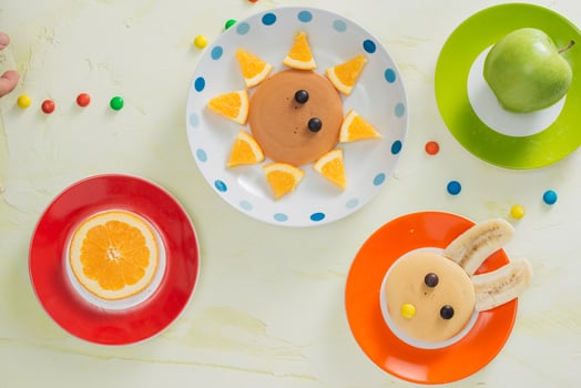 Pancakes with fruit for the children. Top view photo
