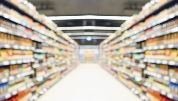 supermarket store aisle interior abstract blurred background photo
