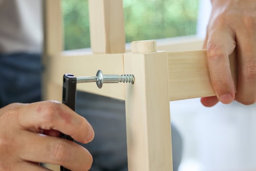 Assembly wooden furniture at home using screw allen photo