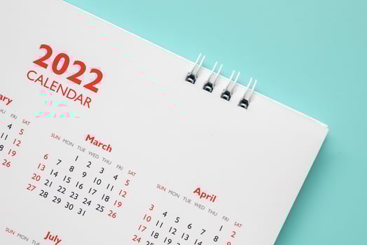 2022 calendar page on blue background business planning appointment meeting concept photo