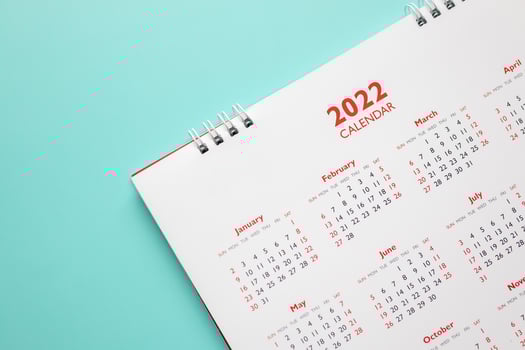 2022 calendar page on blue background business planning appointment meeting concept photo